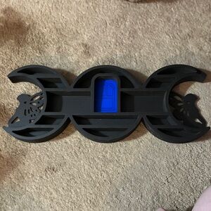 Black and Blue Wall Decor with Butterfly Design. Small shelf for crystals.